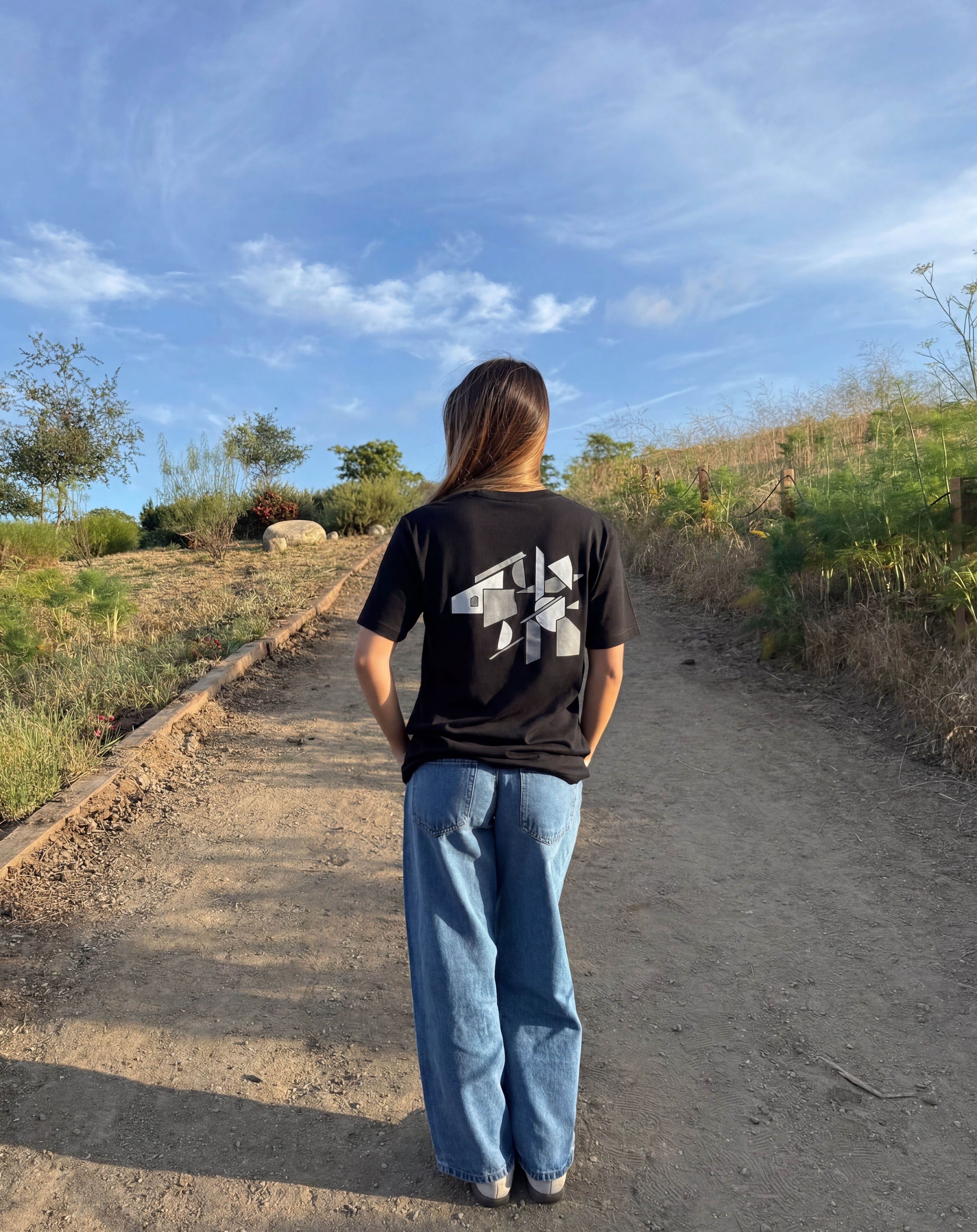 Black graphic logo T-shirt, crew neck, short sleeves; back print visible.