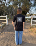 Black crew-neck tee with back square geometric logo patch