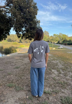 Gray graphic logo T-shirt, crew neck, short sleeves; back print visible.