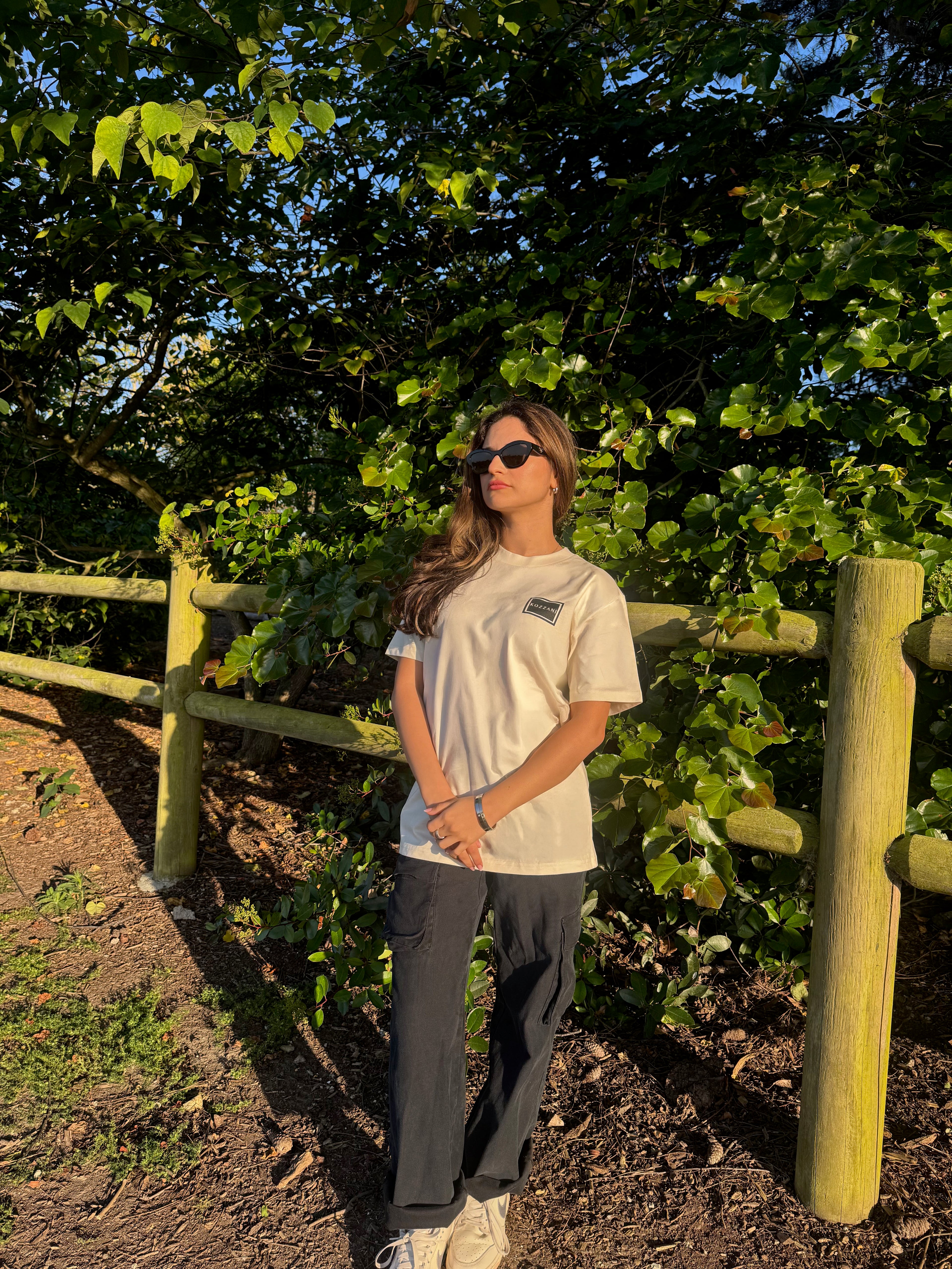 Bone crew-neck tee with small square geometric logo on chest