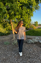 Gray crew-neck T-shirt with small chest logo patch