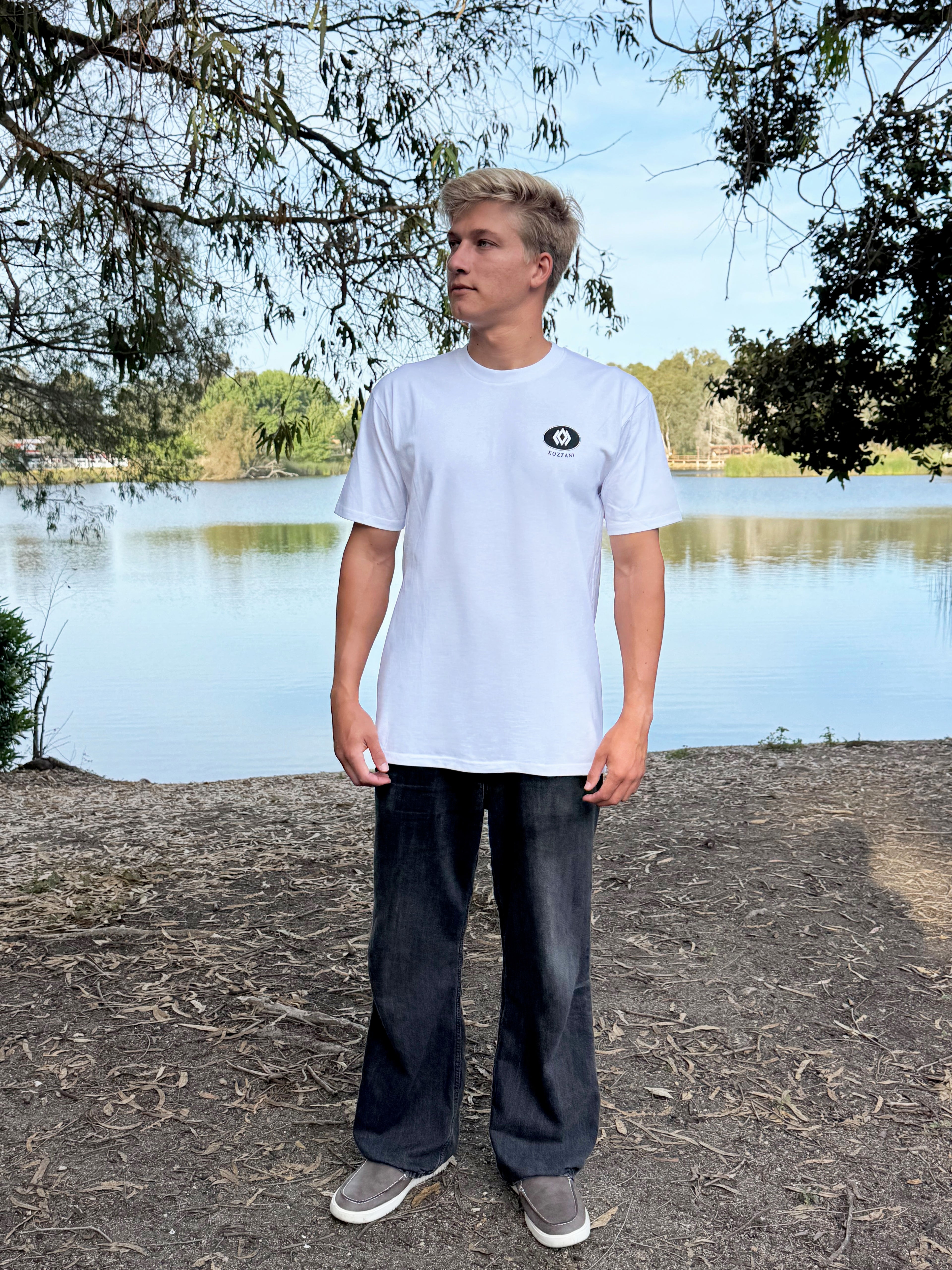 White crew-neck T-shirt with small chest logo patch
