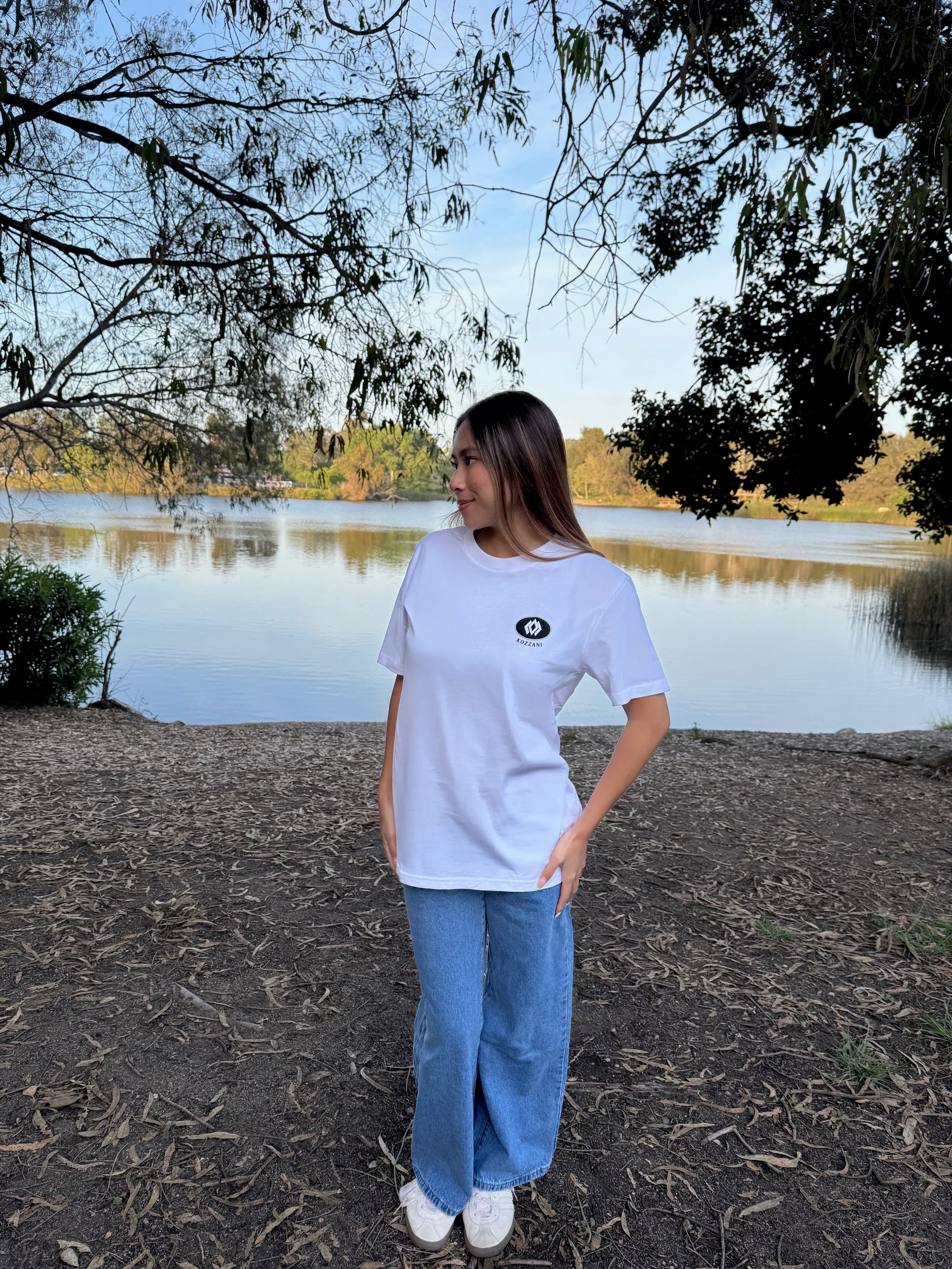 White crew-neck T-shirt with small chest logo patch