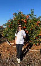White graphic logo T-shirt, crew neck, short sleeves; small front logo.